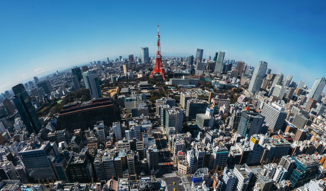 red tower in the city during daytime