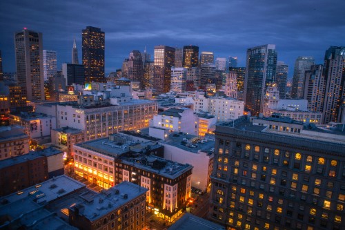 Image city with high rise buildings during night time