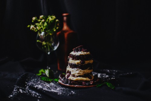 Image brown and white cupcake on black table