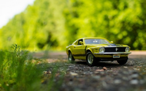 Image yellow chevrolet camaro on road during daytime