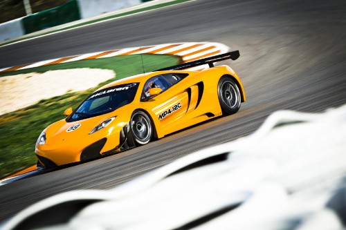 Image yellow and black ferrari sports car on road during daytime