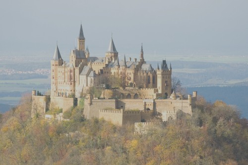 Image brown and white castle on top of hill