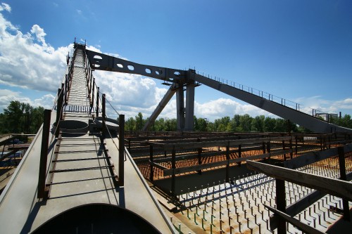 Image white and brown bridge under blue sky during daytime