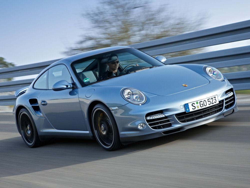 blue porsche 911 on road during daytime