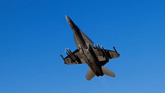 Image gray fighter jet in mid air during daytime