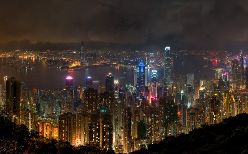 Image city with high rise buildings during night time