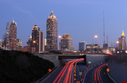 Image time lapse photography of city skyline during night time