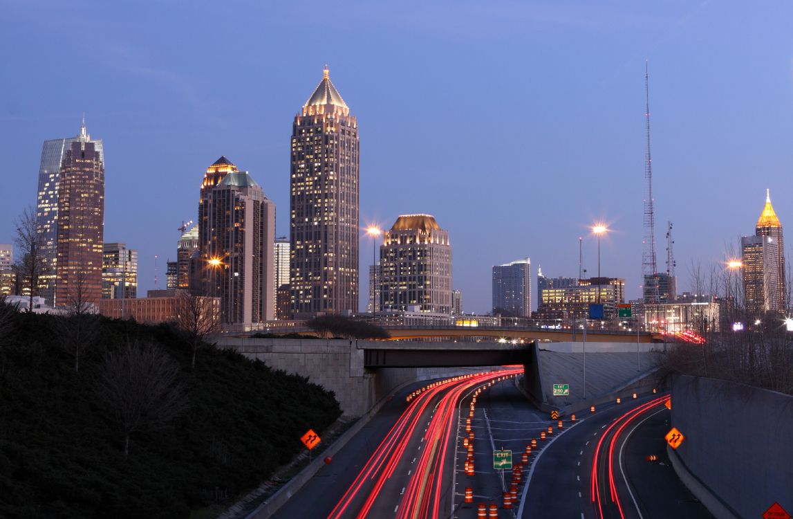 time lapse photography of city skyline during night time