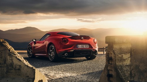 Image red ferrari 458 italia on gray sand during daytime