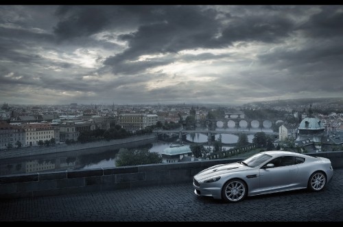 Image silver sedan on road near city buildings during daytime