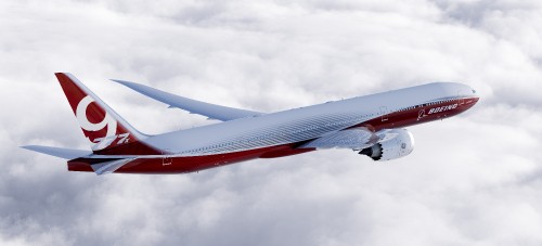 Image red and white airplane under white clouds during daytime