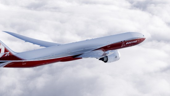 Image red and white airplane under white clouds during daytime