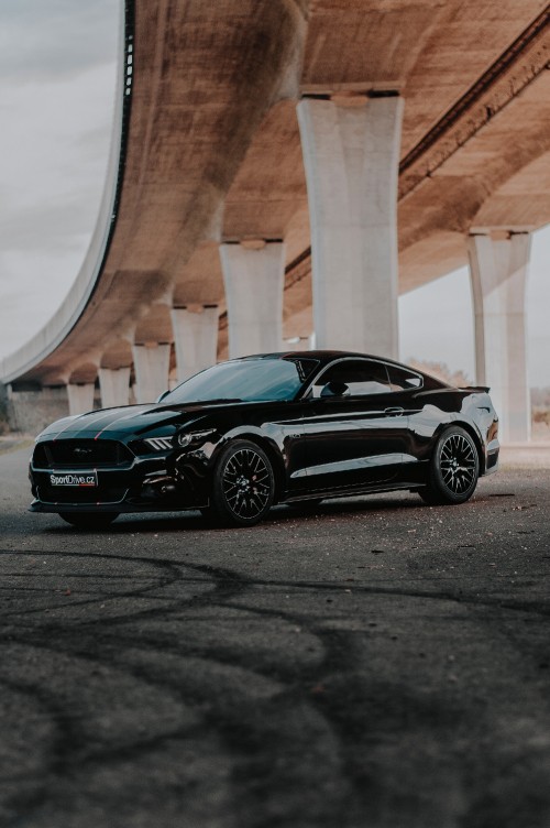 Image black mercedes benz coupe parked on gray concrete road during daytime