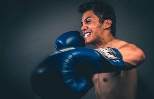 Image man in black and blue boxing gloves