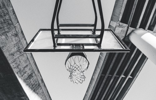 Image black basketball hoop on white wall