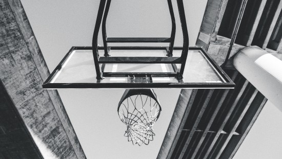 Image black basketball hoop on white wall