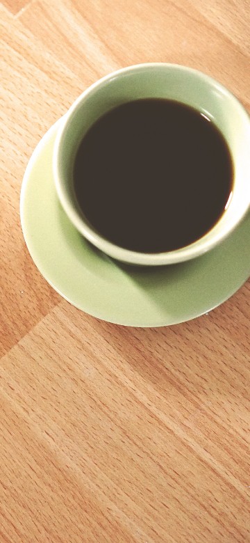 Image white ceramic mug on brown wooden table