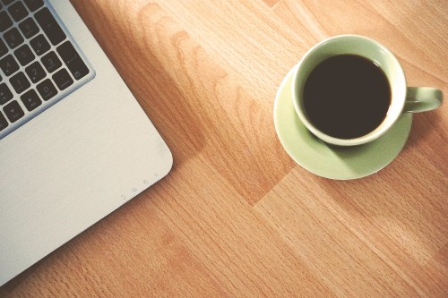 Image white ceramic mug on brown wooden table