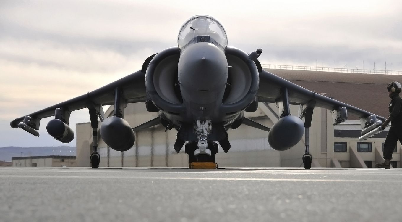 black fighter plane on airport during daytime