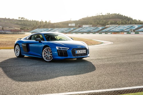 Image blue audi coupe on gray asphalt road during daytime