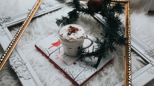 Image white ceramic mug on white and red book