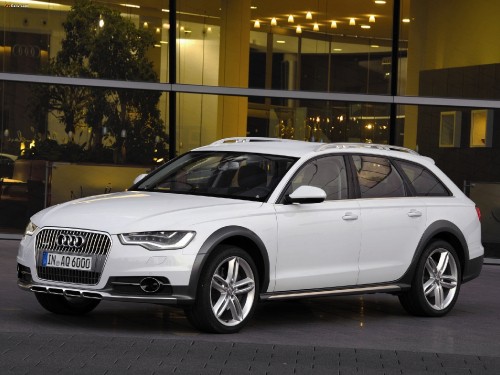 Image white audi a 4 sedan parked near glass window