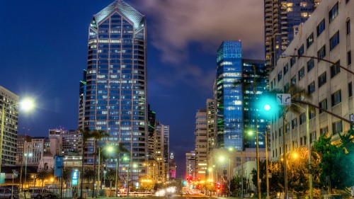 Image city buildings with lights turned on during night time