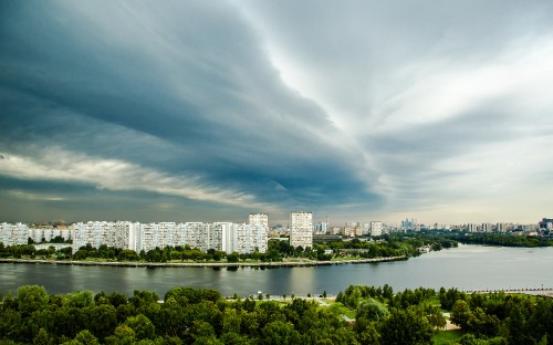 Image city skyline under cloudy sky during daytime