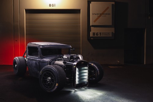 Image black vintage car in front of brown wooden wall