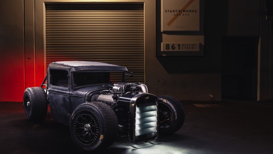 Image black vintage car in front of brown wooden wall