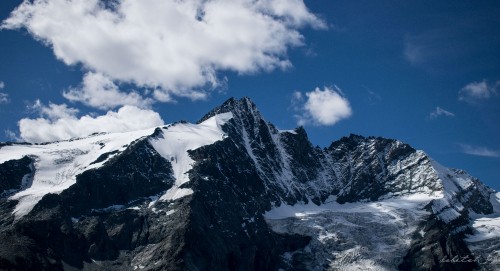 Image snow covered mountain under cloudy sky during daytime