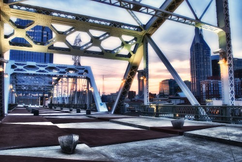 Image brown and gray bridge under blue sky during daytime