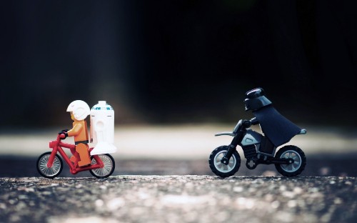 Image black motorcycle with orange and white plastic toy