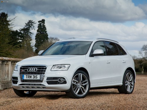 Image white audi suv on brown dirt road during daytime