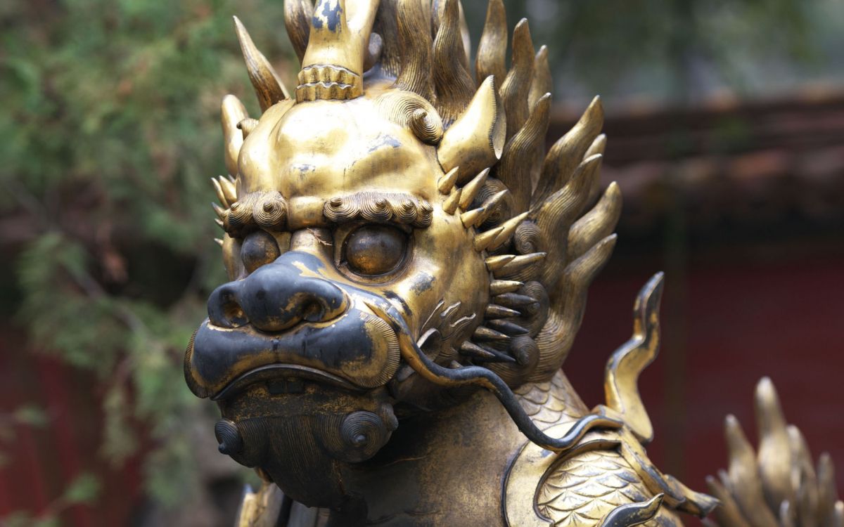 gold dragon statue during daytime