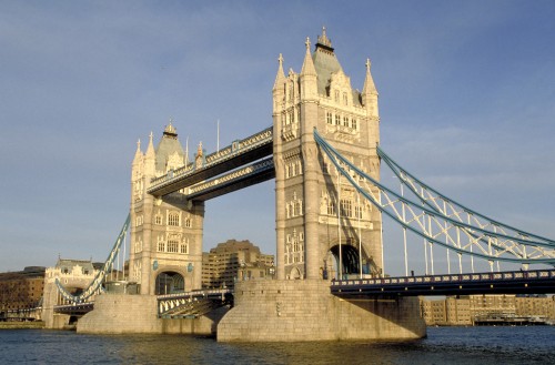 Image brown concrete bridge over river during daytime