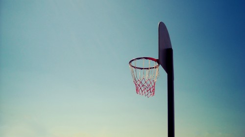 Image basketball hoop under blue sky during daytime