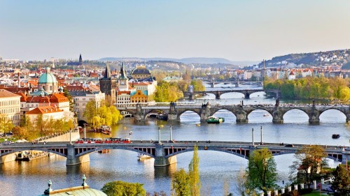 Image bridge over river near buildings during daytime