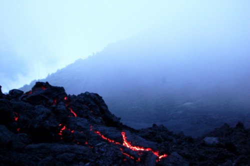 Image black rocky mountain under white sky during daytime