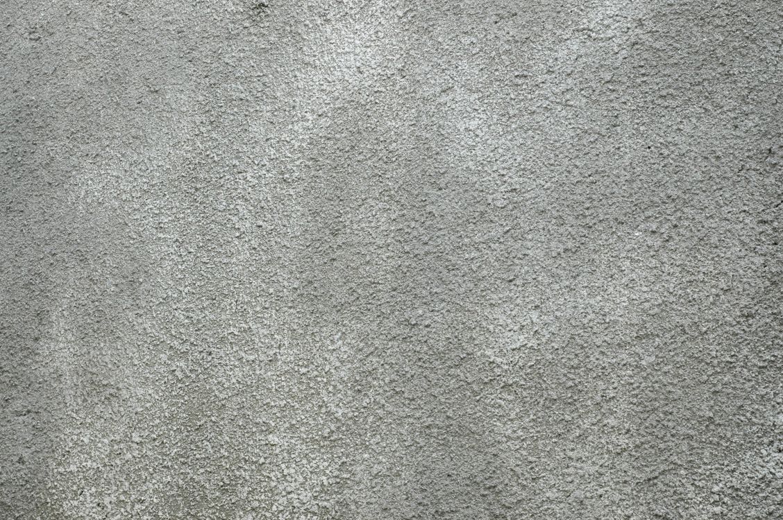 person in black shoes standing on gray carpet