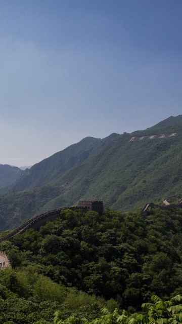 Image green mountains under blue sky during daytime