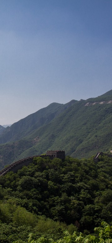 Image green mountains under blue sky during daytime