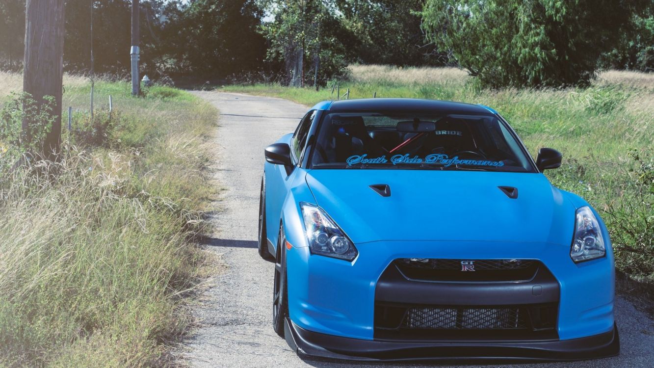 blue bmw m 3 on road during daytime