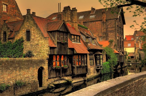 Image brown brick building near river