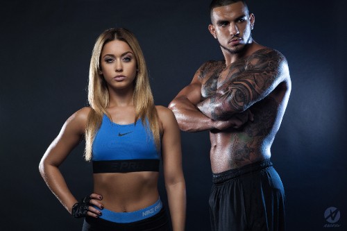 Image woman in blue sports bra and black skirt