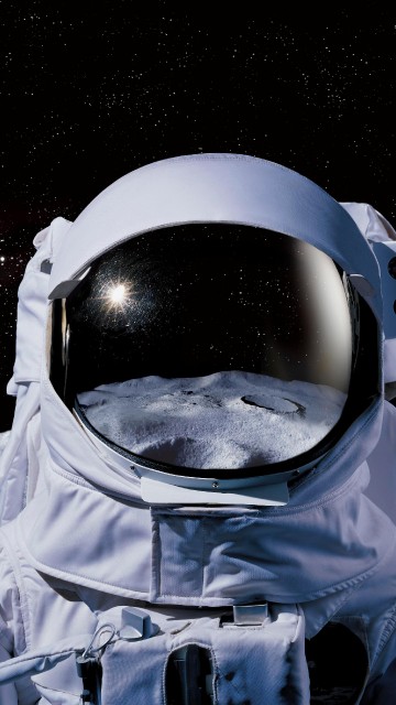 Image person in blue jacket wearing white goggles