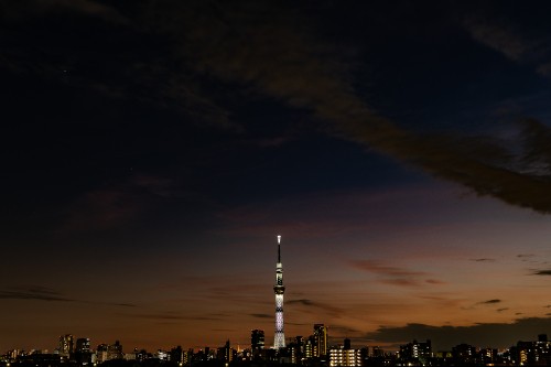 Image city skyline under white clouds during daytime