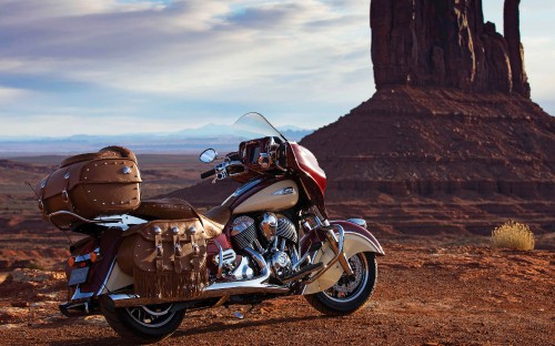 Image black and silver cruiser motorcycle on brown sand during daytime