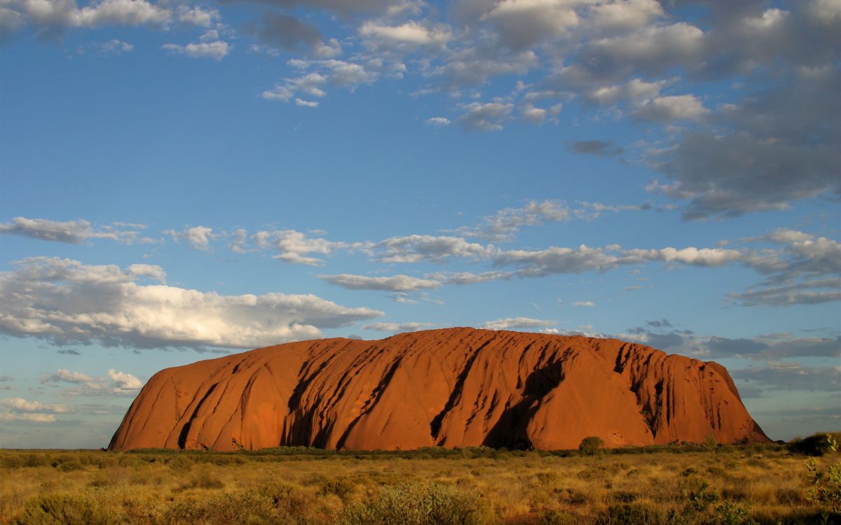 brown mountain under blue sky during daytime