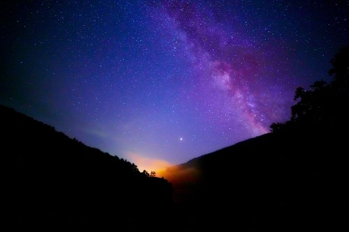 Image silhouette of mountain under starry night